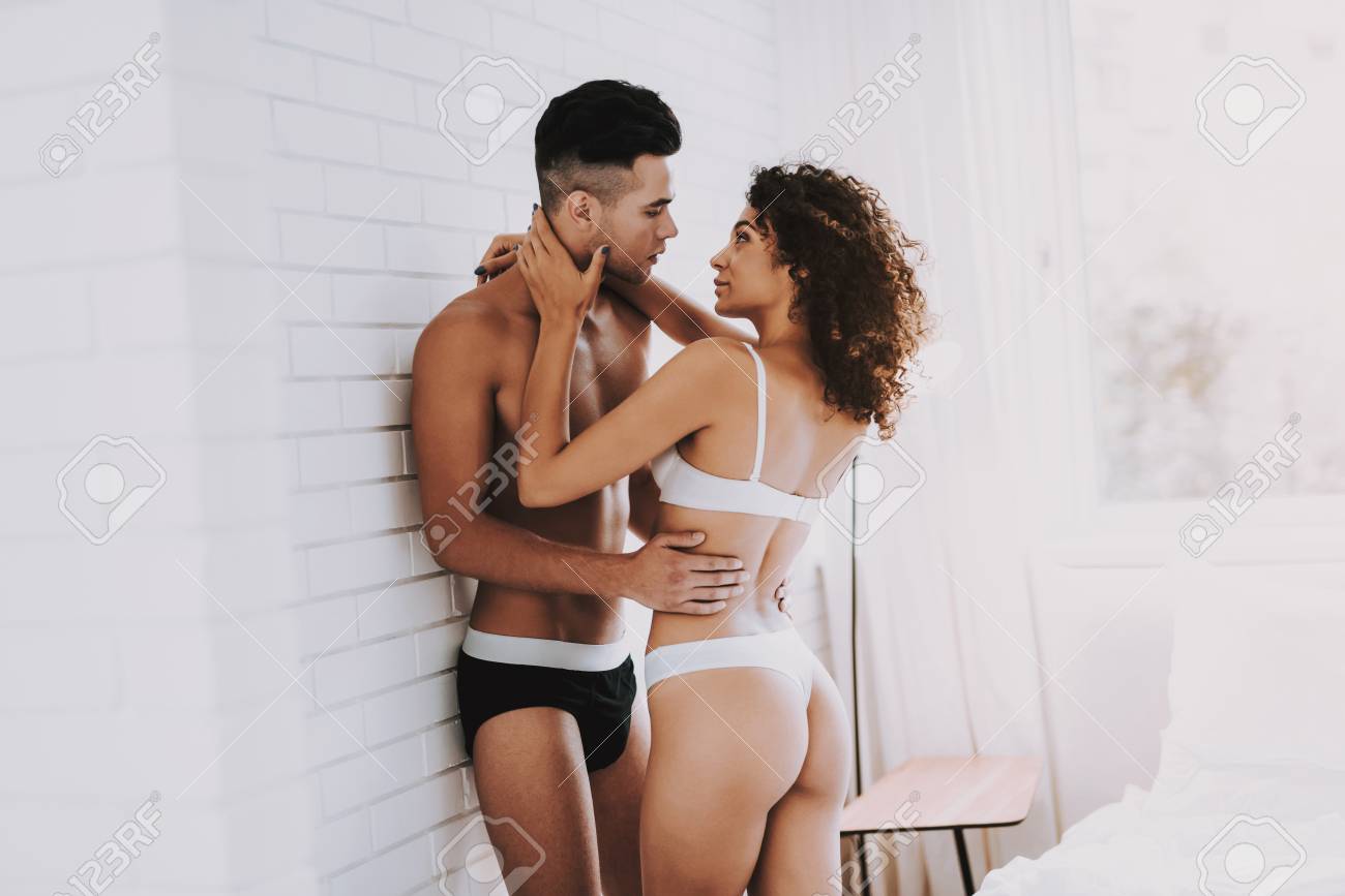 109692712-young-beautiful-couple-in-underwear-in-bedroom-handsome-man-and-attractive-woman-in-love.jpg