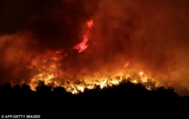 Hellish
        conditions: Fire, smoke and super-heated air have forced the
        evacuation of around 1,200 people in the Santa Eularia area of
        Ibiza. Firefighters are battling to control the blaze