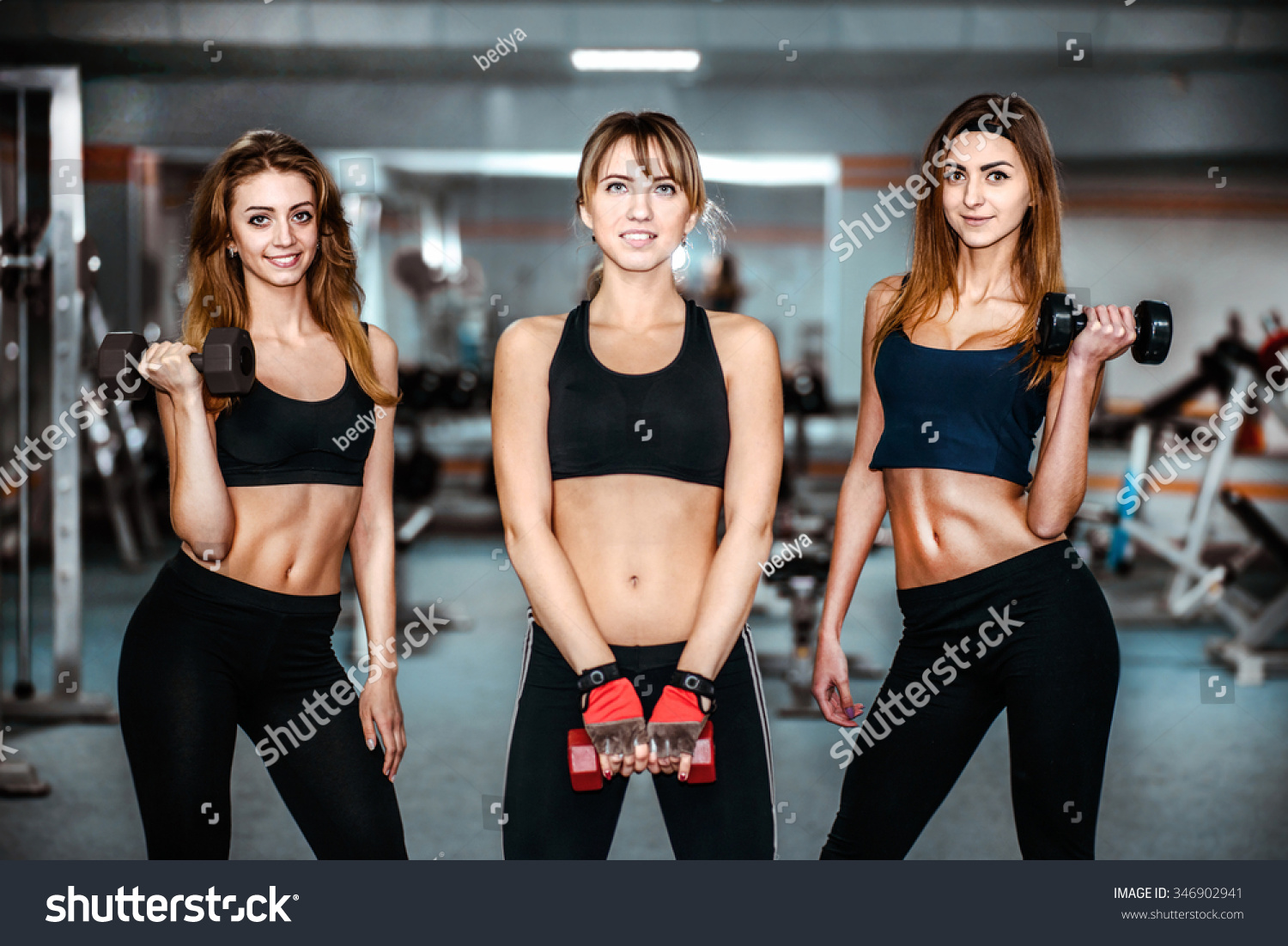 stock-photo-three-pretty-girls-workout-in-the-gym-346902941.jpg