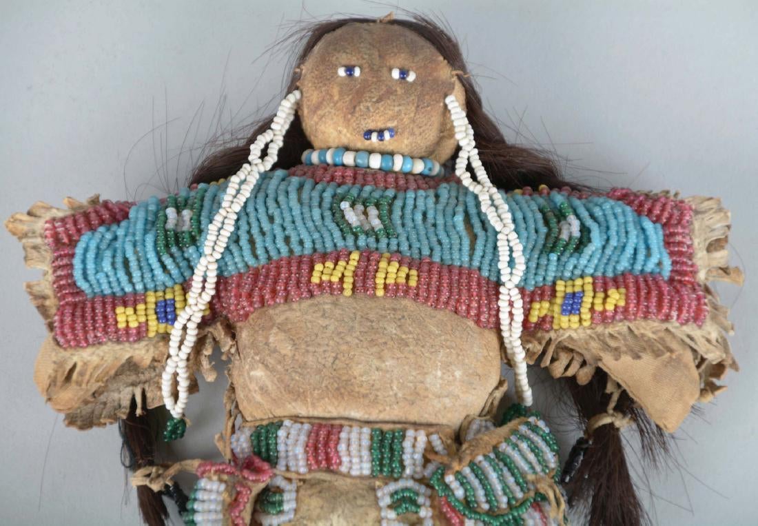 Doll Circa 1880's, made of Indian tanned buckskin and human hair. Entirely sinew sewn fringed dress with buffalo hair,2.jpg