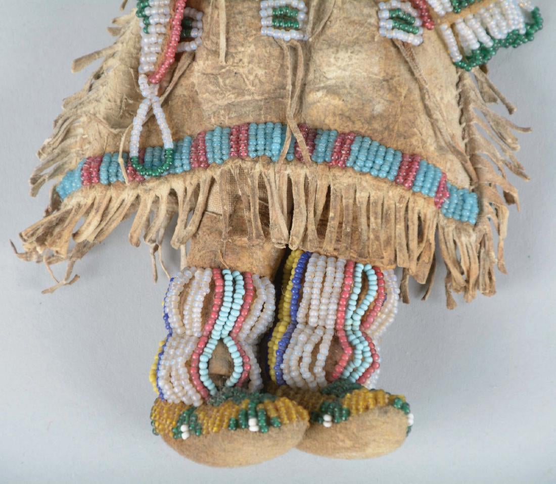 Doll Circa 1880's, made of Indian tanned buckskin and human hair. Entirely sinew sewn fringed dress with buffalo hair,3.jpg