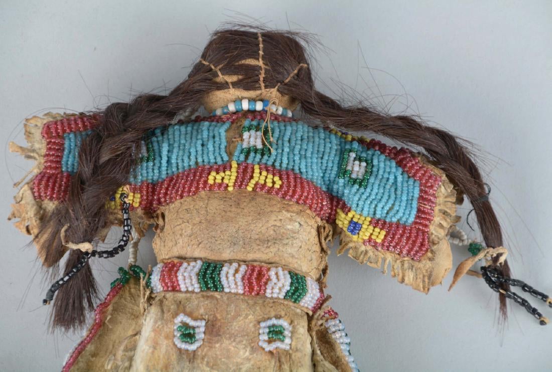 Doll Circa 1880's, made of Indian tanned buckskin and human hair. Entirely sinew sewn fringed dress with buffalo hair,5.jpg