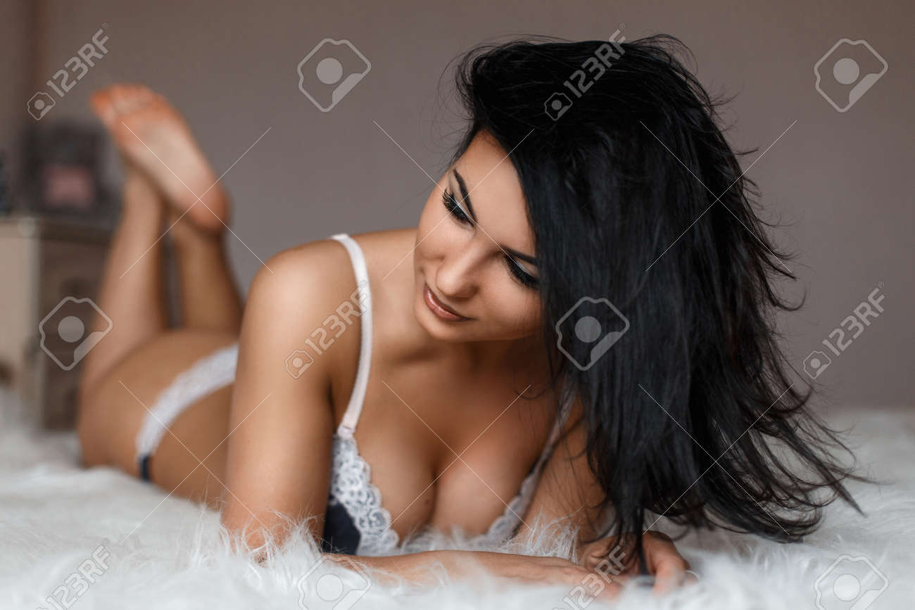 53191753-young-beautiful-woman-in-lingerie-lying-on-the-bed.jpg