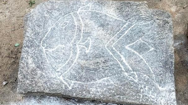 fish stone inscription.jpg