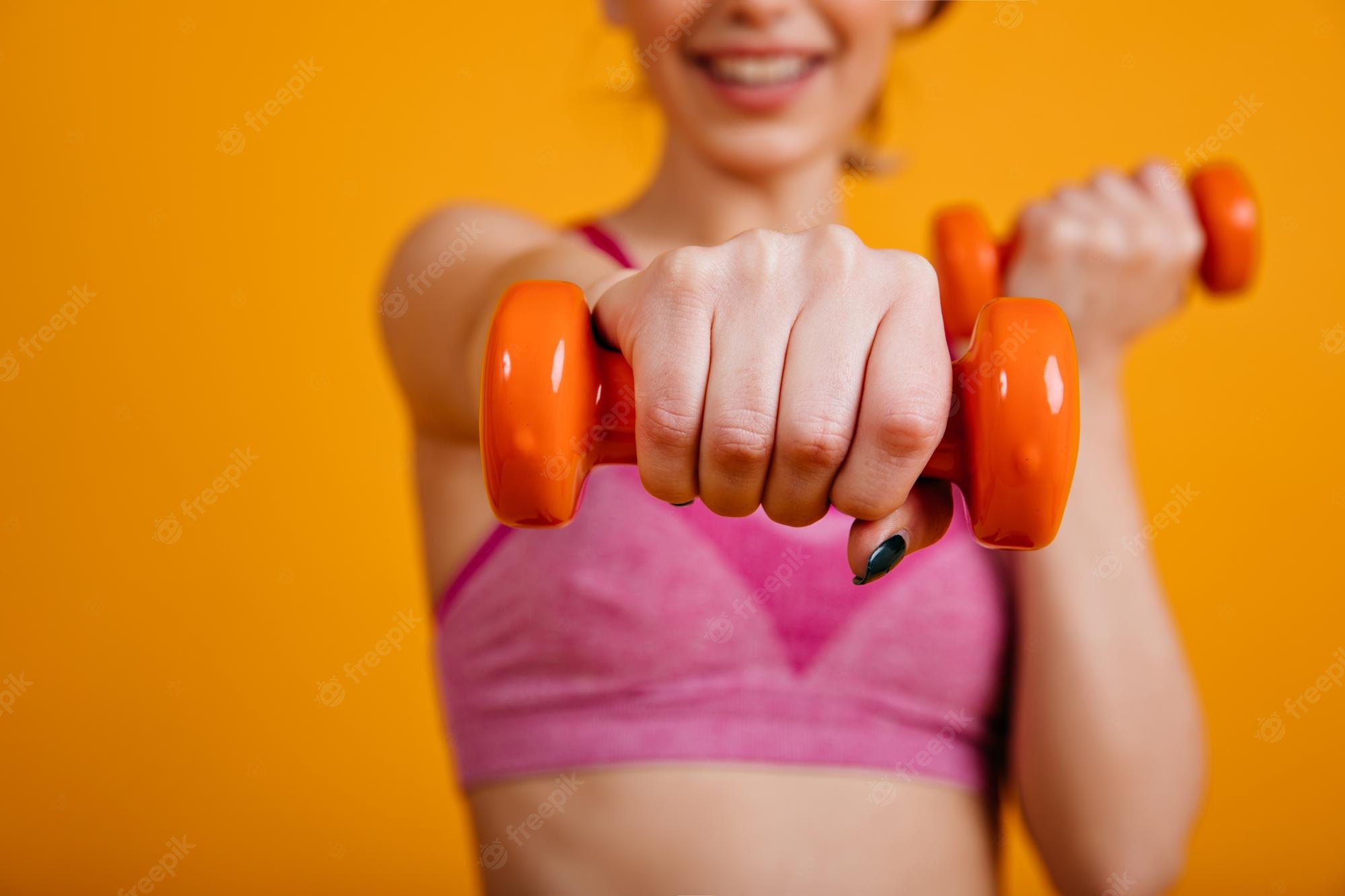 [Image: smiling-girl-posing-with-dumbbels-athlet...0.3&view=1]