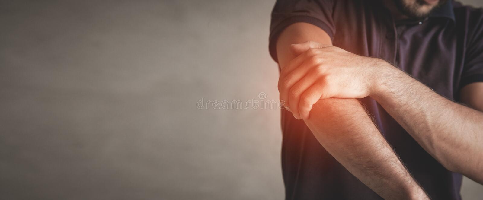caucasian-man-elbow-pain-pain-relief-concept-caucasian-man-elbow-pain-pain-relief-concept-179808710.jpg