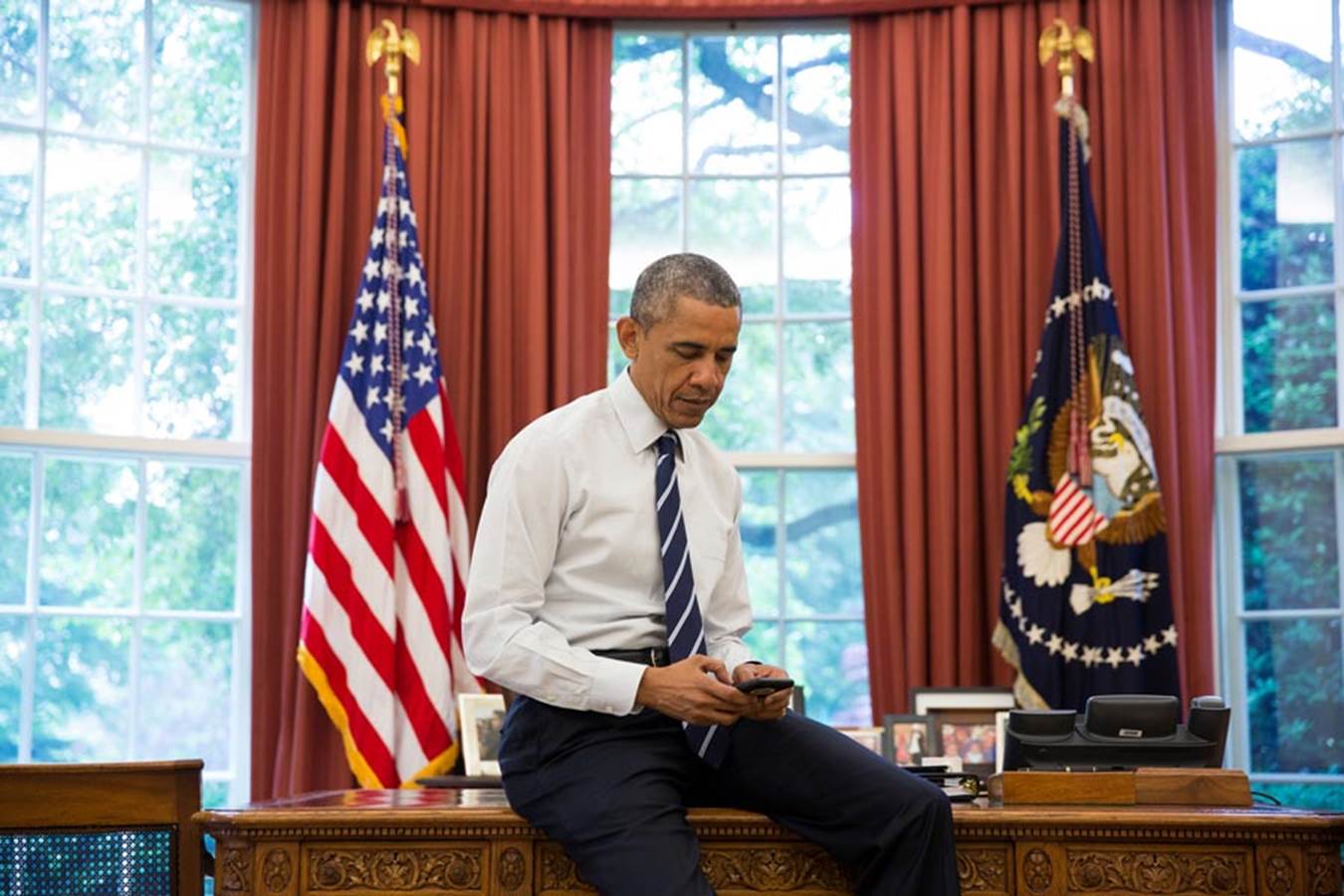 President Obama on his iPhone