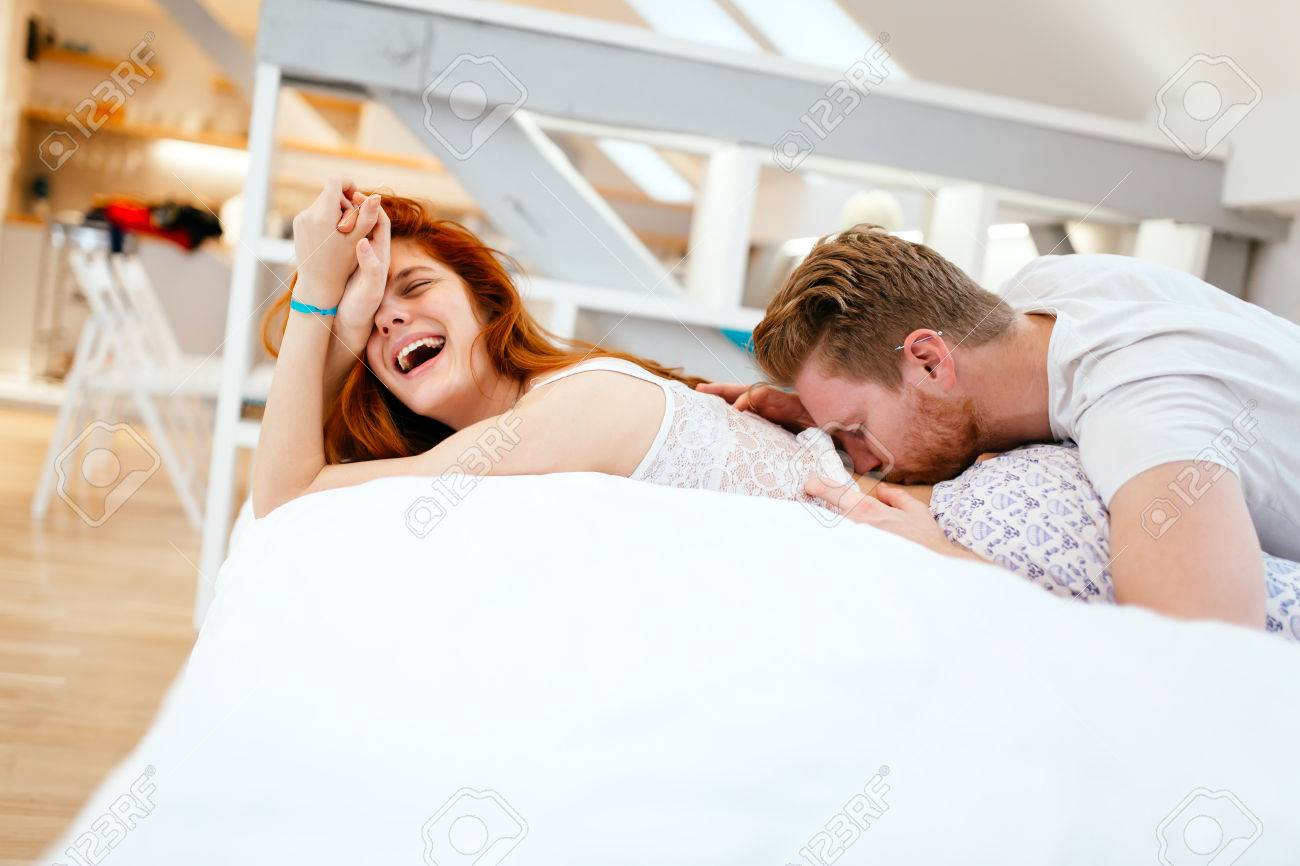 53842945-romantic-couple-in-love-lying-on-bed-and-being-passionate.jpg